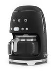 Matte black Smeg coffee machine on a white background