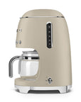 Side view of matte beige Smeg coffee machine on a white background