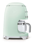 Side view of pastel green Smeg coffee machine on a white background