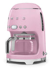 Pink Smeg coffee machine on a white background