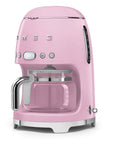 Pink Smeg coffee machine on a white background