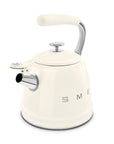 Cream-colored stovetop kettle with silver features on a white background