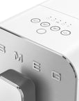 Close-up of a Smeg appliance with control buttons on a white background
