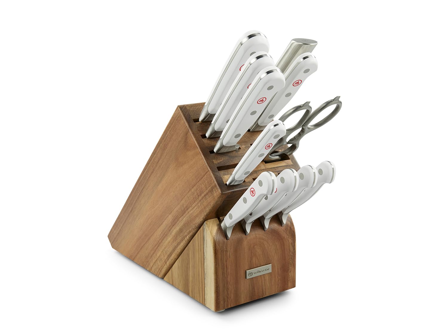 Set of knives in a wooden block on a white background