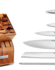Wooden knife block with knives and a set of scissors on a white background