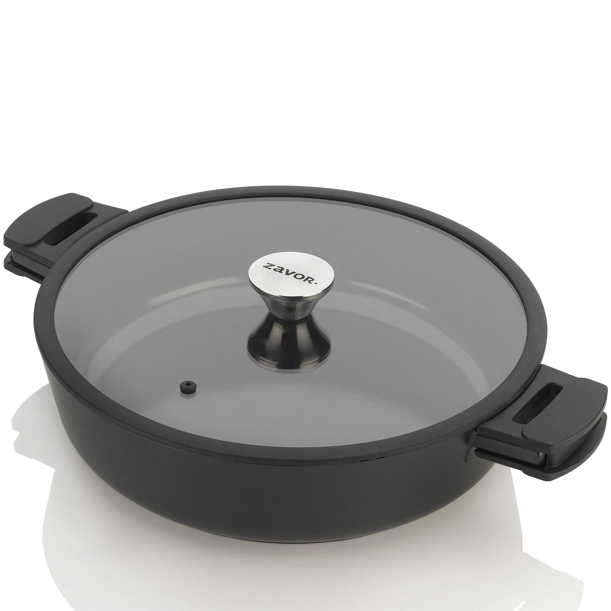 A black ZAVOR Noir 6 qt saute pan with a titanium-reinforced ceramic coating, featuring a glass lid and minimalist design on a white background.