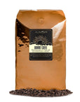 5 lb decaf coffee bag with coffee beans in front displayed on a white background