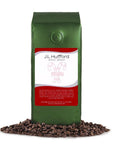 1 lb J.L. Hufford Spiced Eggnog Coffee bag with coffee beans in front displayed on a white background