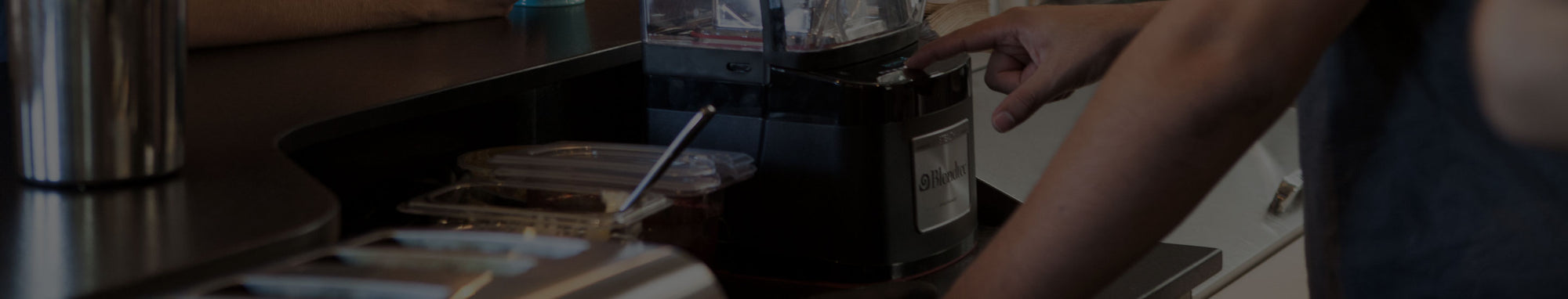 Man Using Blendtec Commercial Blender
