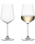 Two clear stemmed wine glasses on a white background, with the left glass empty and the right glass partially filled with pale white wine.
