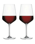 Two clear wine glasses filled with red wine, shown side by side on a plain white background.