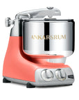 Coral crush kitchen stand mixer with silver bowl on a white background