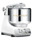 Ankarsrum stand mixer with white base and silver bowl on a white background