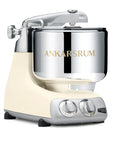 Ankarsrum stand mixer with light creme base and silver bowl on a white background