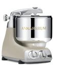 Ankarsrum stand mixer with beige base and silver bowl on a white background