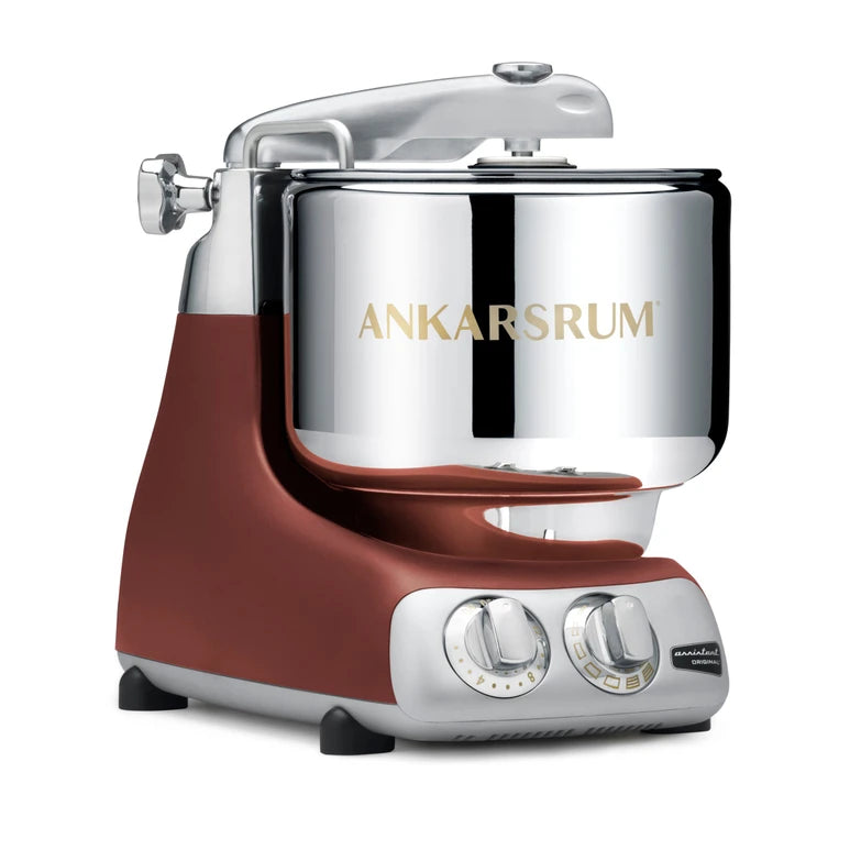 Ankarsrum stand mixer with a rustic maroon base and silver top on a white background