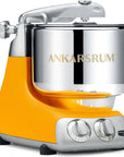 Ankarsrum sunbeam yellow stand mixer with yellow base and silver bowl on a white background