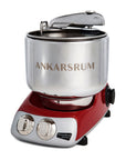 Ankarsrum stand mixer with red base and silver bowl on a white background