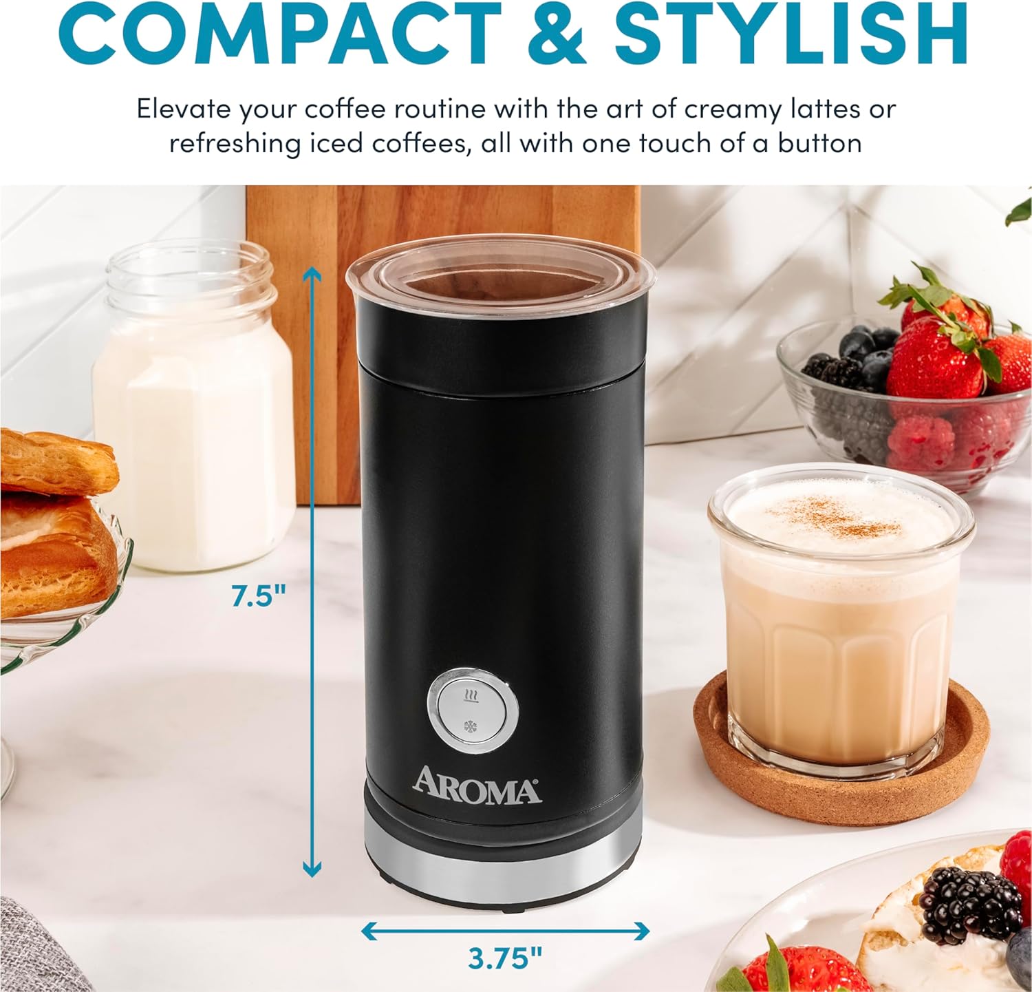 Black Aroma coffee maker on a kitchen counter with a glass of coffee and berries in the background.