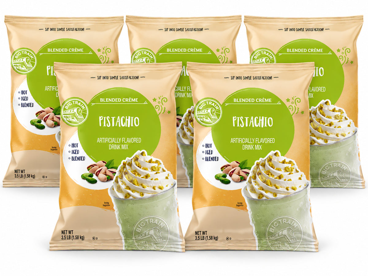 Five bags of Pistachio Blended Crème drink mix arranged in two rows against a white background. The front bags are fully visible, showing the beige packaging with a green circular logo and an illustration of a pistachio drink with whipped cream and pistachios.