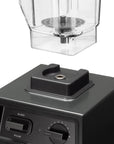 Black blender base with clear container on a white background