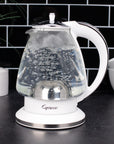 White and polished chrome Capresso 48 oz electric kettle with water boiling on a kitchen counter with a tiled wall background