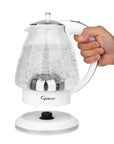 White and polished chrome Capresso 48 oz electric kettle with handle, held by a hand on a white background.