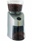 Coffee grinder with coffee beans on a white background