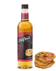 DaVinci Praline syrup bottle with cookies on a white background