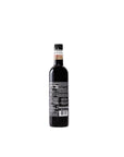 Bottle of dark liquid on a white background