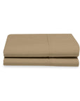 Folded beige bed sheet set on a white background