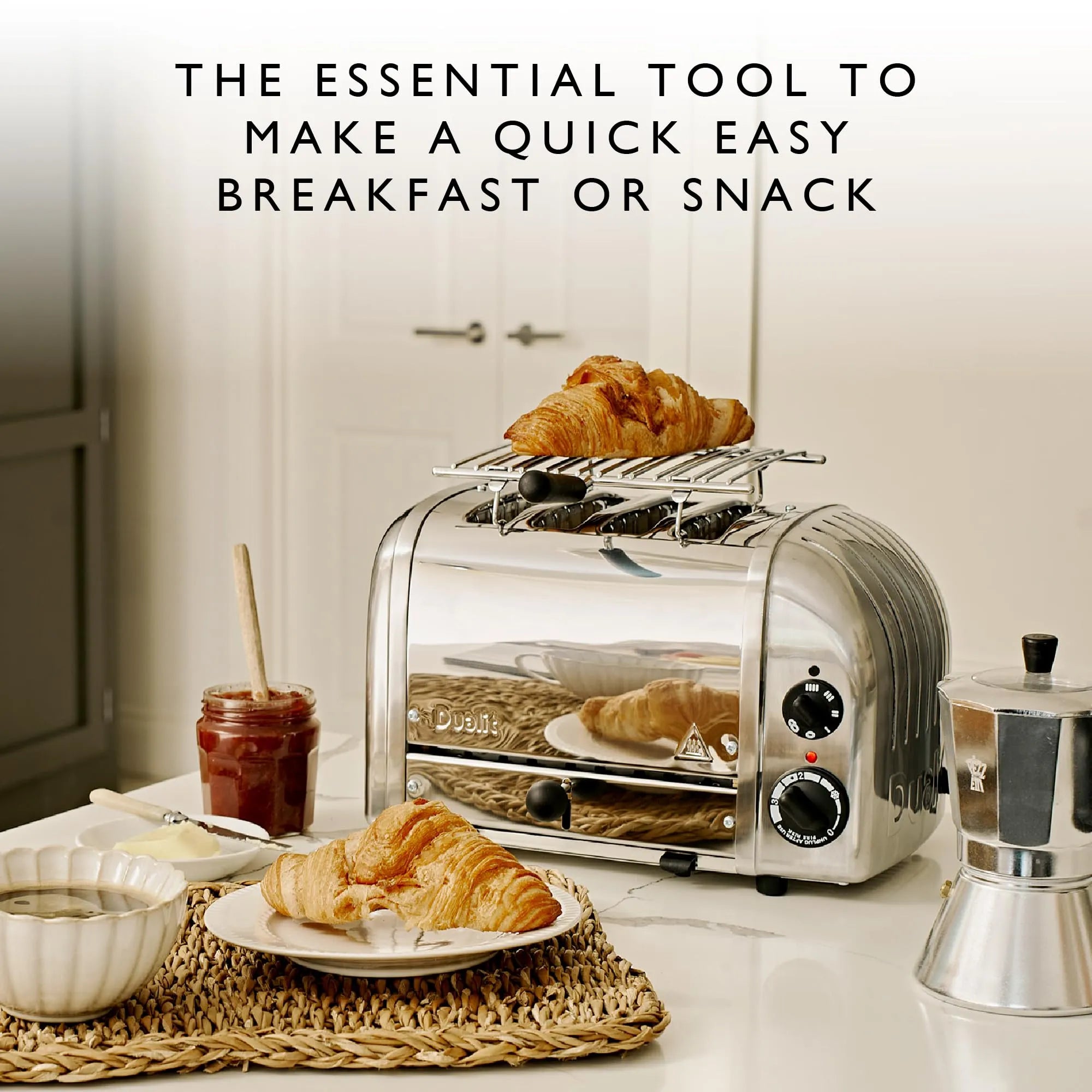 Toaster with croissants on a kitchen counter with text about quick breakfast or snack.