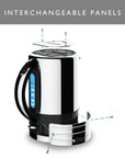 A stainless steel and black electric kettle with a transparent lid showing a replacement heating panel, labeled as an interchangeable panel. The image includes a gray header at the top reading 'INTERCHANGEABLE PANELS' and a white background.