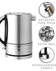 A stainless steel electric kettle with a black handle and base trim, shown on a white background with three circular feature callouts reading 'PATENTED PURE POUR', 'RAPID BOIL', and 'INTERCHANGEABLE PANELS'. The kettle brand 'Dualit' is embossed on the lower front.