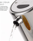 Stainless steel kettle with Dualit branding and 'Pure Pour' spout feature.