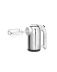 A stainless steel hand mixer with two beaters, shown from a three-quarters angle on a solid white background.