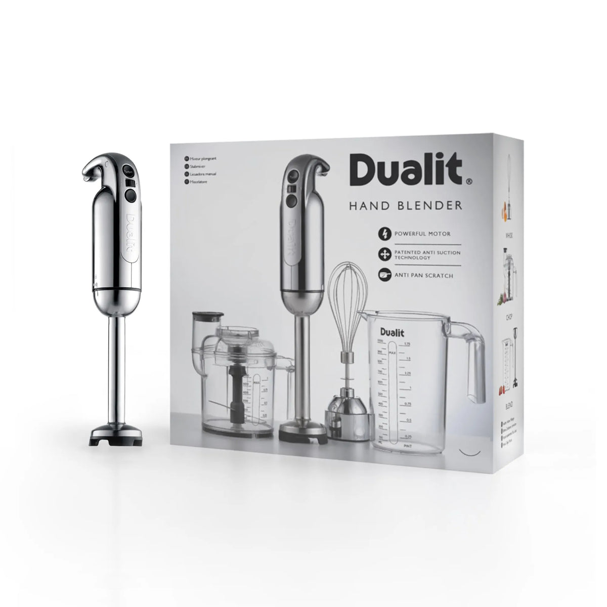 A Dualit hand blender shown next to its retail packaging box on a clean white background. The hand blender has a metallic silver body and black base, and the box displays the product and included accessories like a whisk and measuring cup.