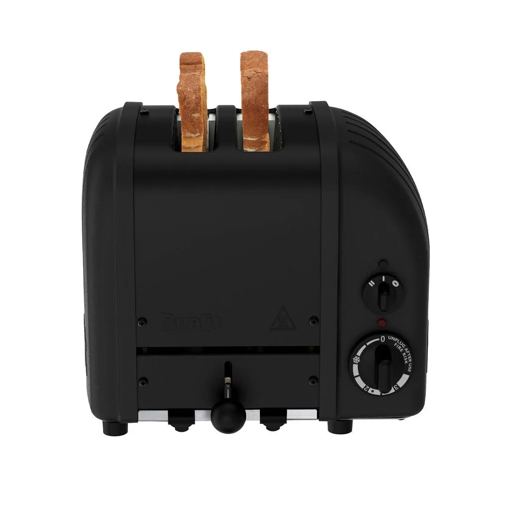 Black toaster with two slices of bread on a white background
