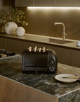 Black toaster on a kitchen counter with a modern kitchen background