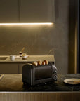 Modern toaster on a kitchen counter with a marble backsplash