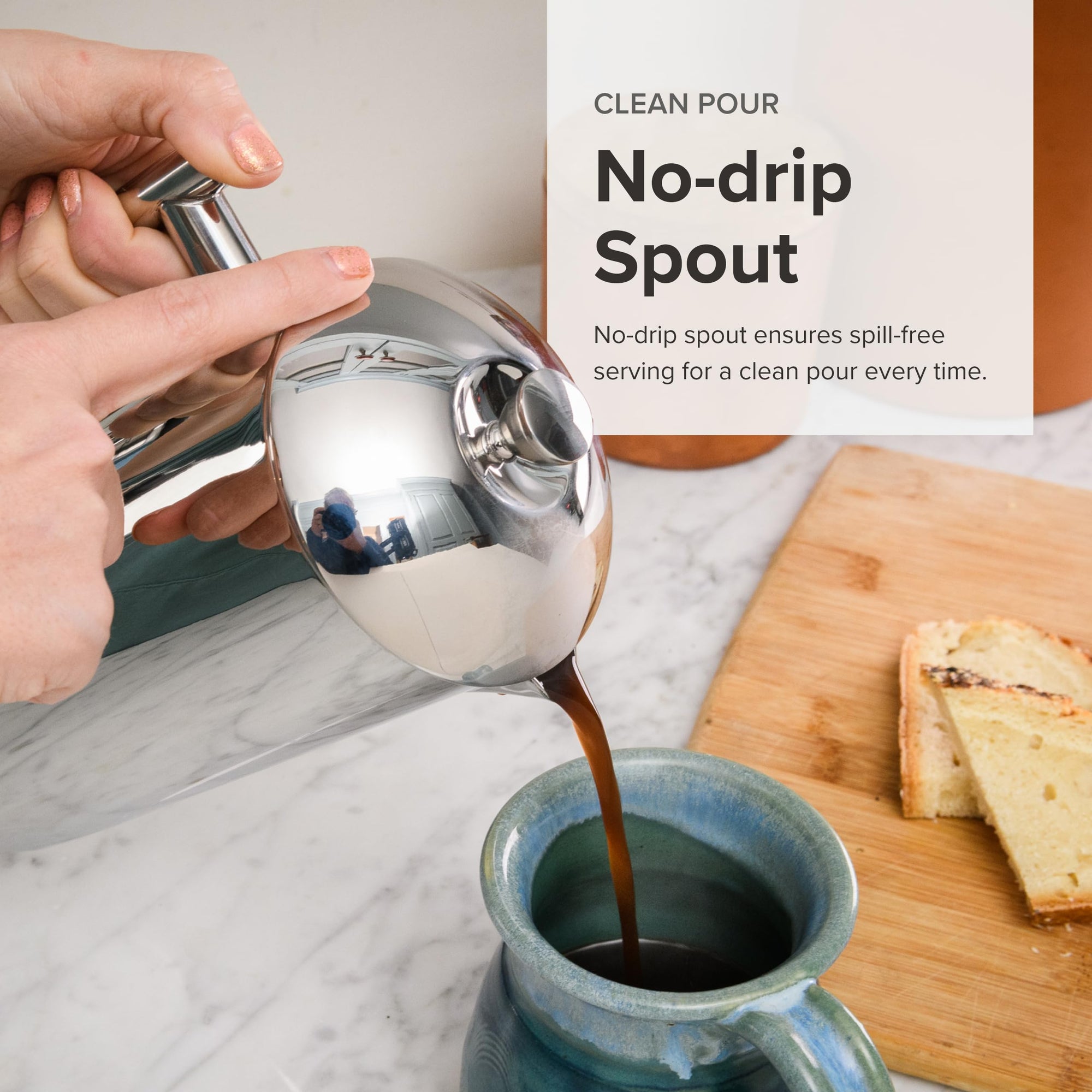 Person using a no-drip spout to pour coffee into a mug with a wooden cutting board and toast in the background.