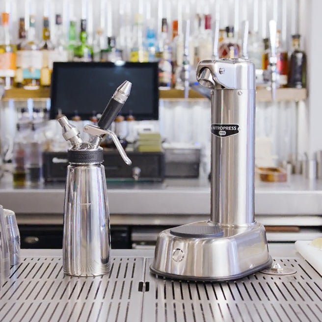 A stainless steel special coffee machine displayed on a coffee bar setting.