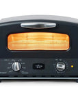 Front view of matte black toaster oven on with knobs displayed on a white background