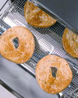 Bagels on a cooling rack inside a toaster oven