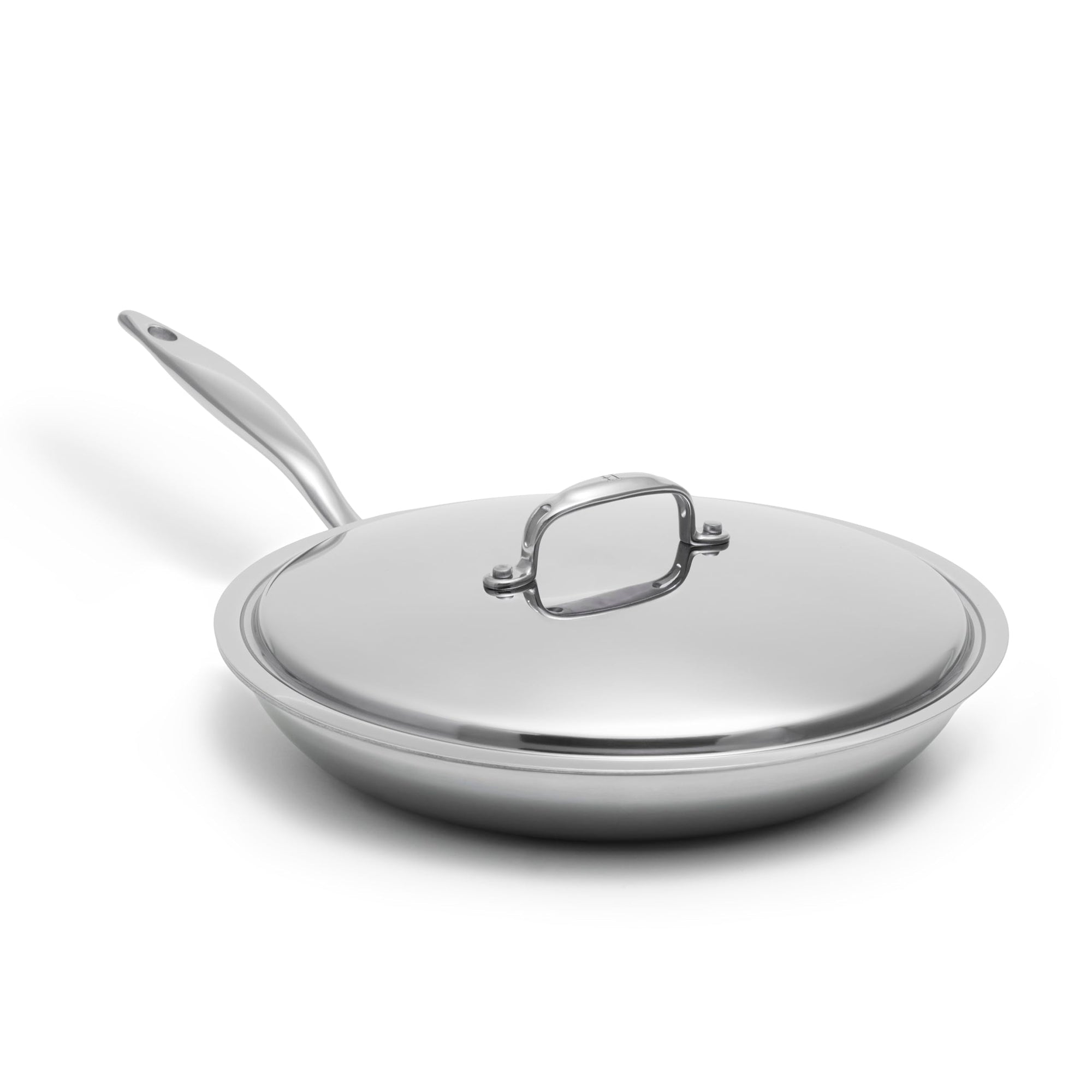 Stainless steel frying pan with lid on a white background