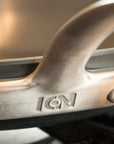 Close-up of a metal handle with 'ION' branding on a pot.