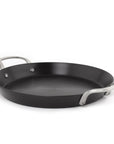 Black frying pan with silver handles on a white background