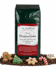 1 lb Decaf Christmas Cookie coffee beans bag with coffee beans and Christmas cookies in front displayed on a white background