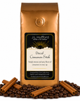 1 lb Decaf Cinnamon Stick coffee beans bag with coffee beans and cinnamon sticks in front displayed on a white background