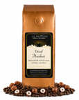 1 lb J.L. Hufford Decaf Hazelnut coffee bag with coffee beans and hazelnuts on a white background